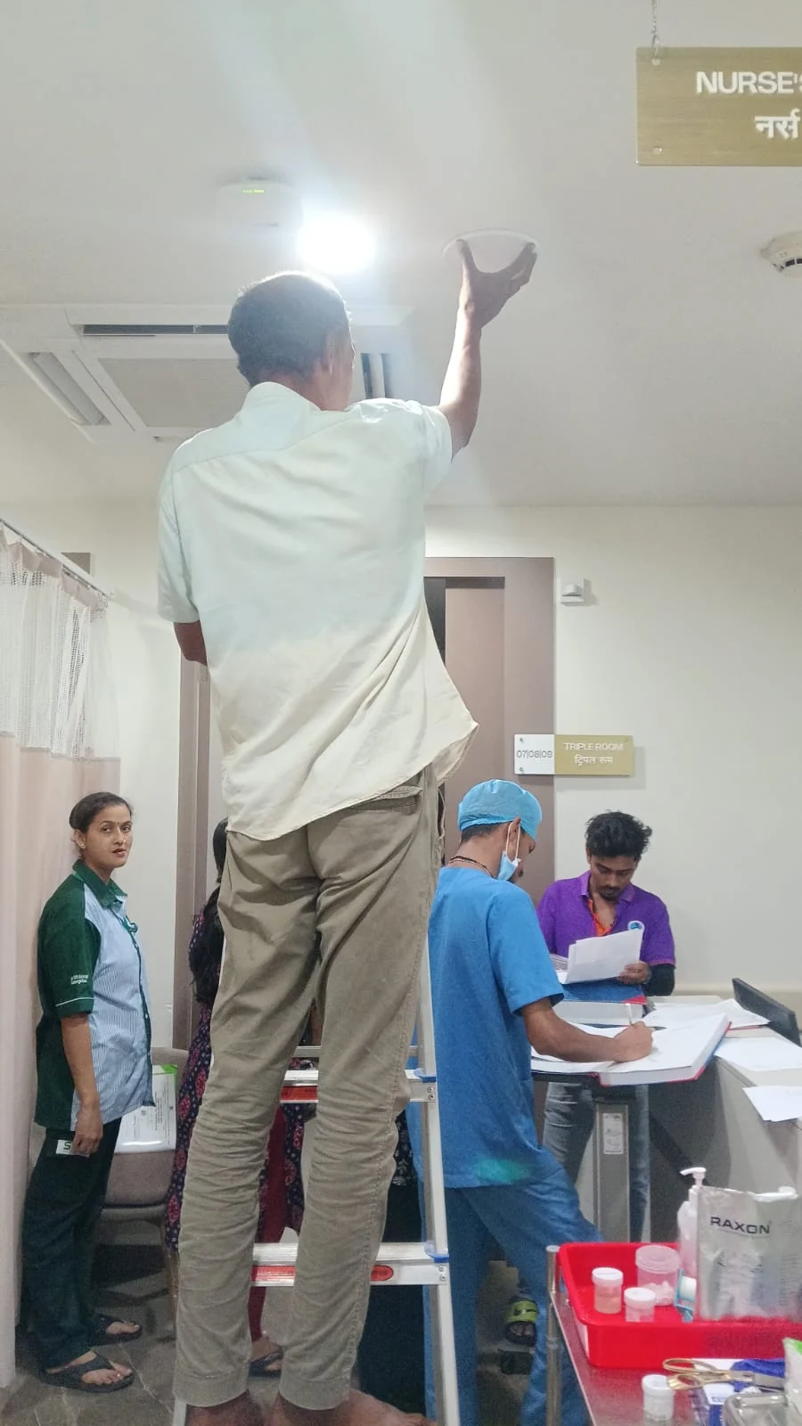 Signal booster indoor antenna being installed in a commercial interior