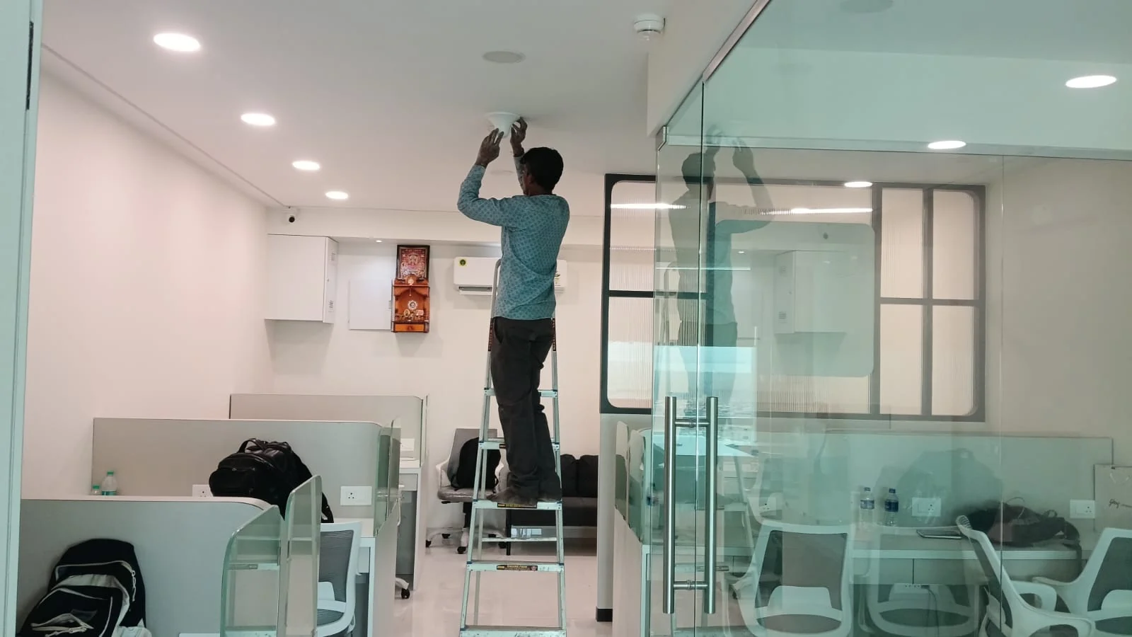 Indoor mobile signal booster antenna installation in an office